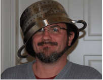 A man wearing a colander as Pastafarian headgear